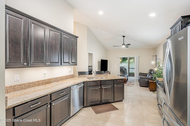 2097 Attilburgh Blvd, Melbourne, FL 32904 - kitchen featuring lofted ceiling, appliances with stainless steel finishes, open floor plan, ceiling fan, and dark brown cabinets