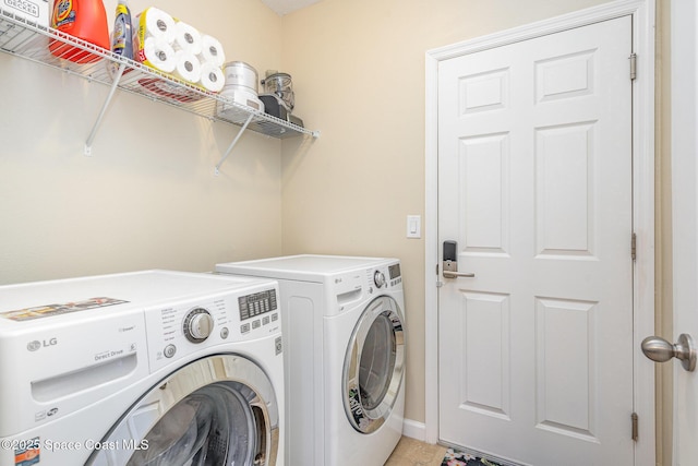 2097 Attilburgh Blvd, Melbourne, FL 32904 - laundry area with washing machine and clothes dryer and baseboards
