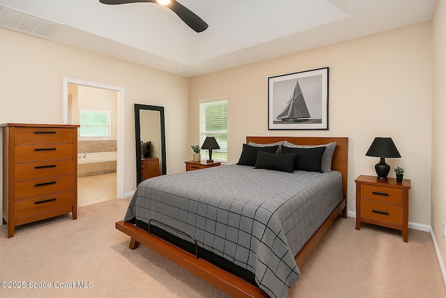 2097 Attilburgh Blvd, Melbourne, FL 32904 - bedroom featuring light carpet, ensuite bathroom, and ceiling fan