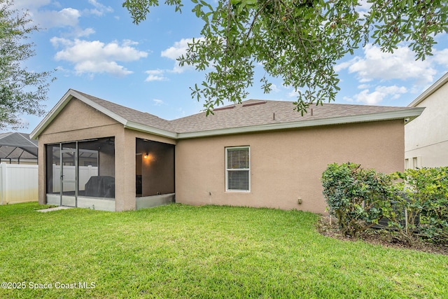2097 Attilburgh Blvd, Melbourne, FL 32904 - rear view of property featuring a sunroom, stucco siding, and a shingled roof