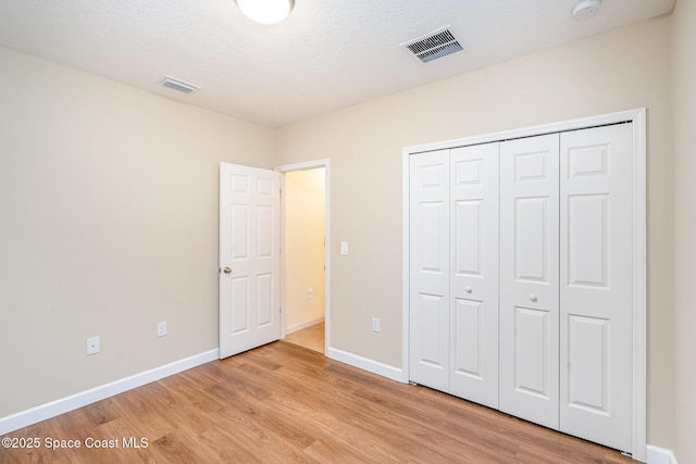 2097 Attilburgh Blvd, Melbourne, FL 32904 - unfurnished bedroom featuring light wood-style flooring and a closet