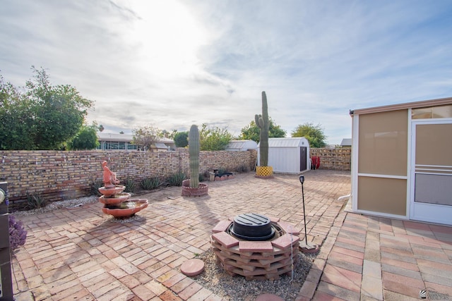 view of patio / terrace with a storage shed