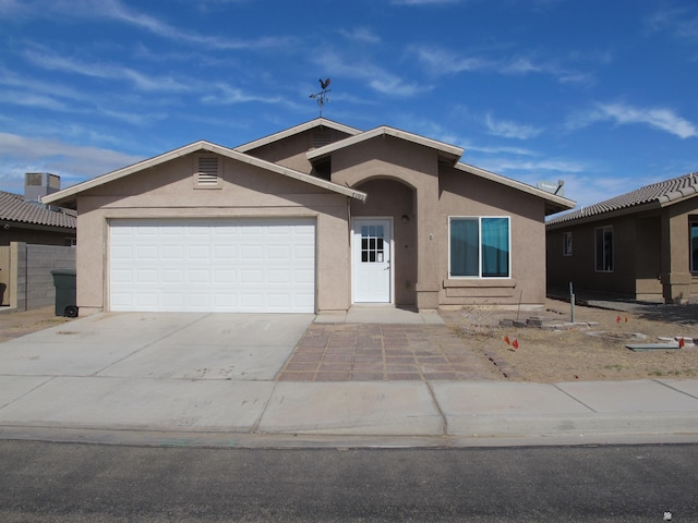 ranch-style home featuring a garage