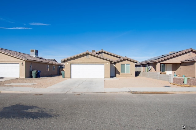 ranch-style house featuring solar panels, a garage, and central AC