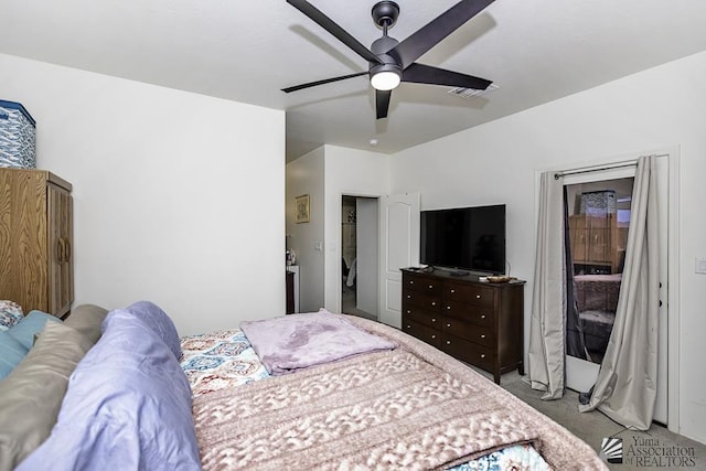 bedroom featuring ceiling fan, visible vents, and light colored carpet