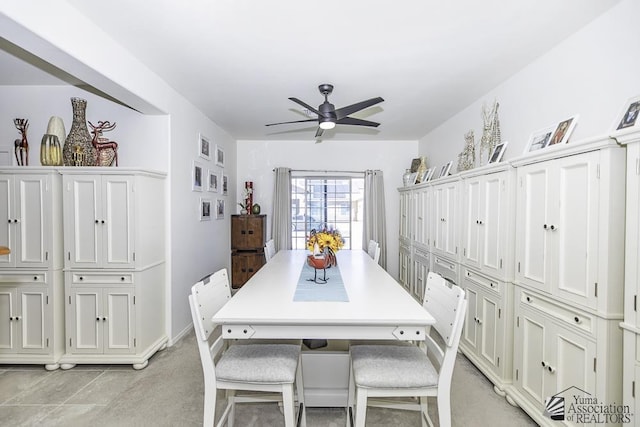 dining room with a ceiling fan