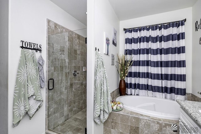 full bathroom with a garden tub and a shower stall