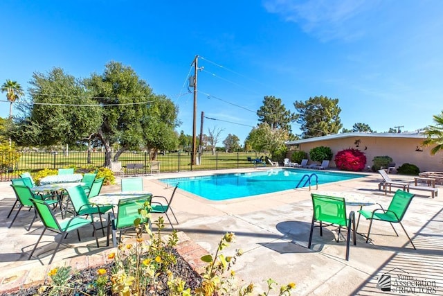 view of swimming pool featuring a patio area