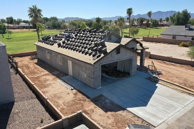 birds eye view of property with a mountain view