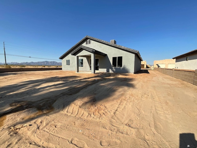 view of front of property with a mountain view