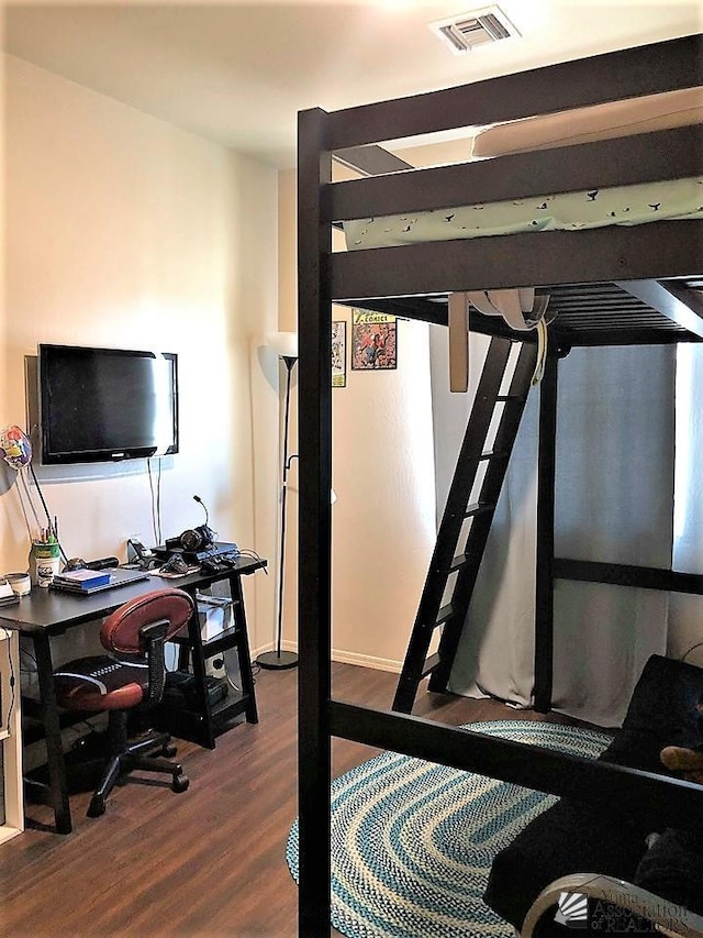 bedroom featuring wood-type flooring