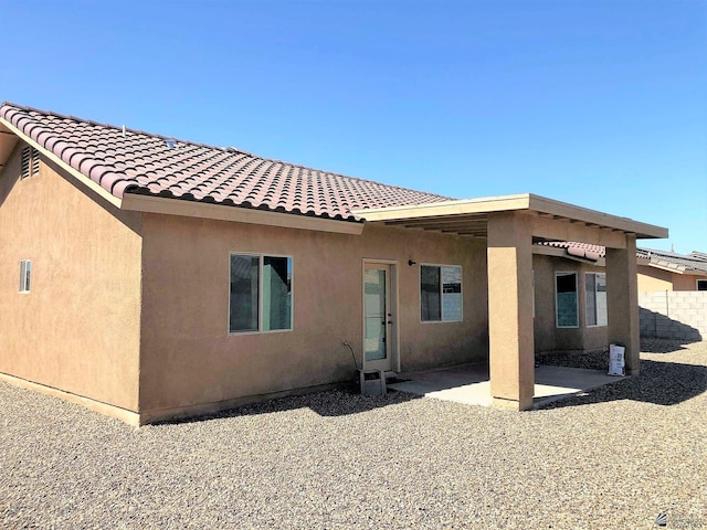 rear view of house with a patio