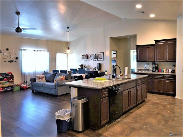 kitchen featuring an island with sink, black dishwasher, sink, and dark brown cabinetry