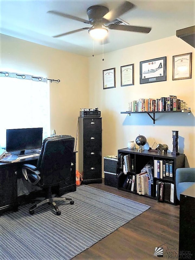 office with dark hardwood / wood-style floors and ceiling fan