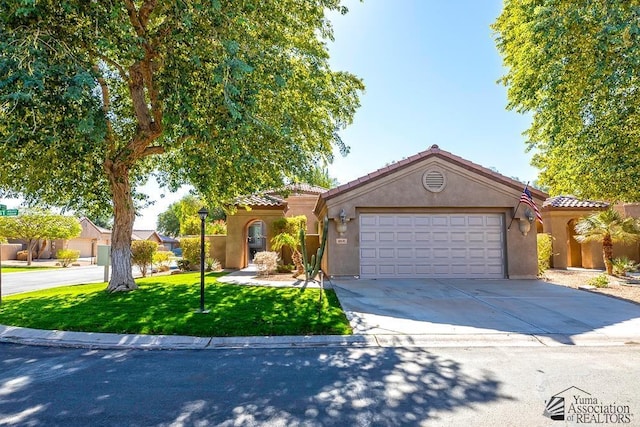 view of front of home featuring a garage and a front yard