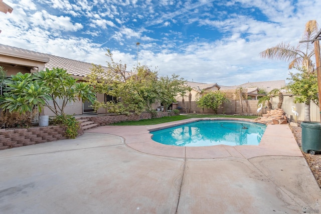 view of swimming pool with a patio area