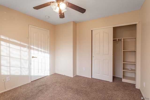 unfurnished bedroom with ceiling fan and carpet