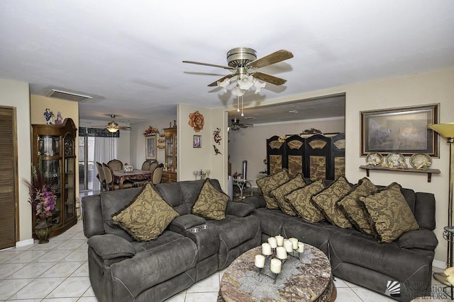 living room featuring ceiling fan and light tile patterned flooring