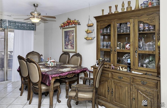 dining space with ceiling fan and light tile patterned floors