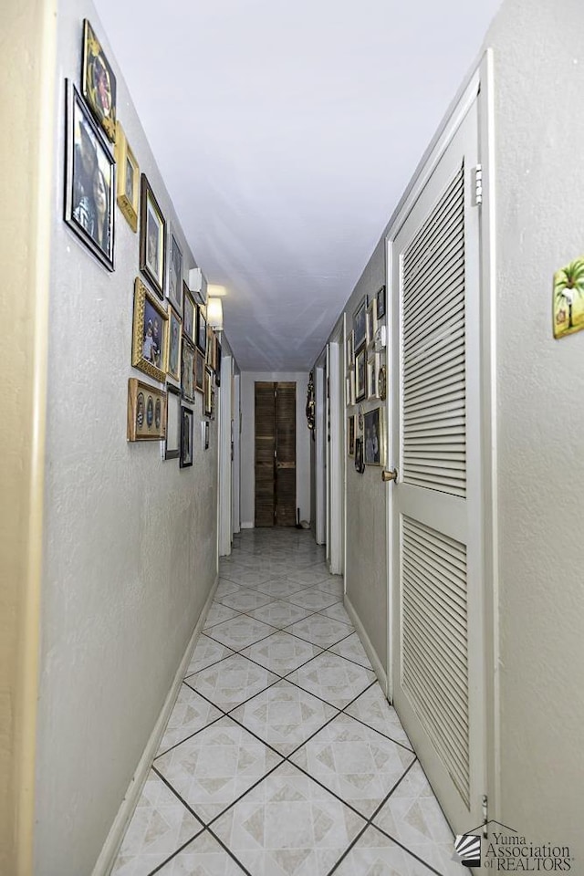 hallway with light tile patterned floors