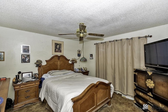 bedroom featuring ceiling fan, a textured ceiling, and dark colored carpet