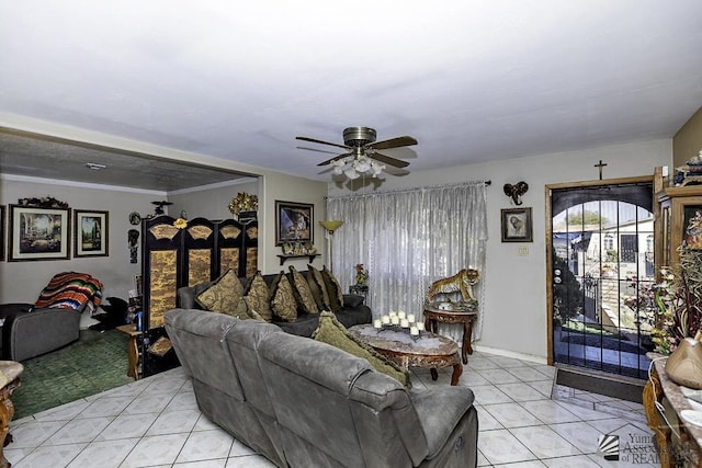 living room featuring ceiling fan and light tile patterned floors