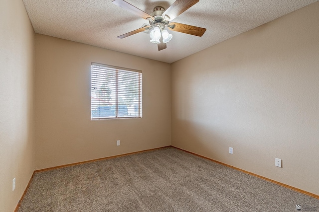 spare room with ceiling fan, carpet, and a textured ceiling