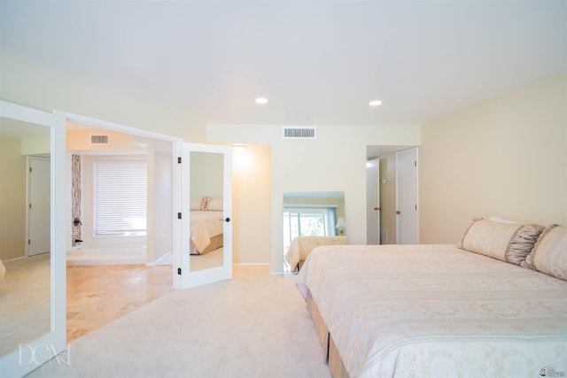 carpeted bedroom with recessed lighting and visible vents