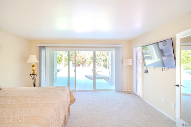 bedroom featuring carpet floors and access to outside