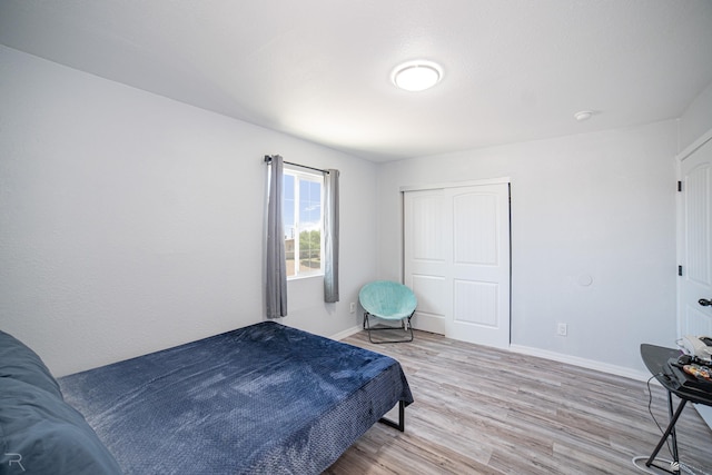 bedroom featuring a closet and light hardwood / wood-style floors