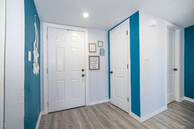 entrance foyer featuring light wood-type flooring