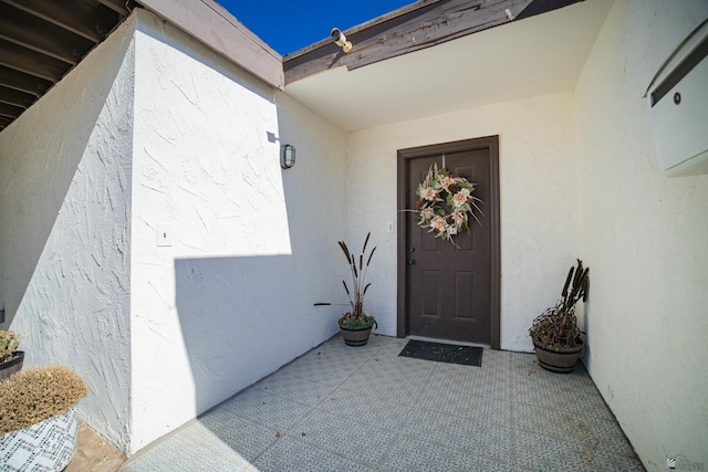 doorway to property featuring a patio