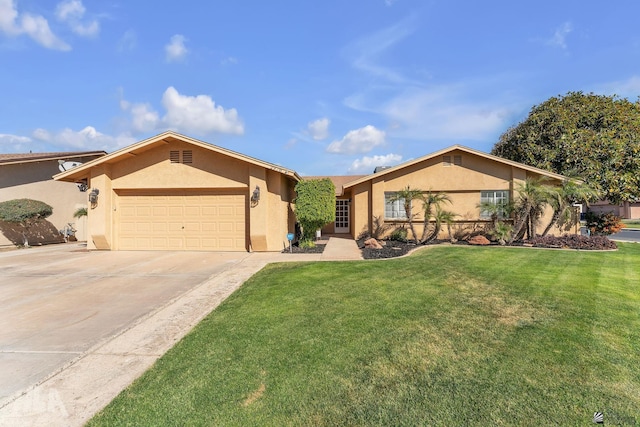 ranch-style house featuring a garage, a front yard, concrete driveway, and stucco siding