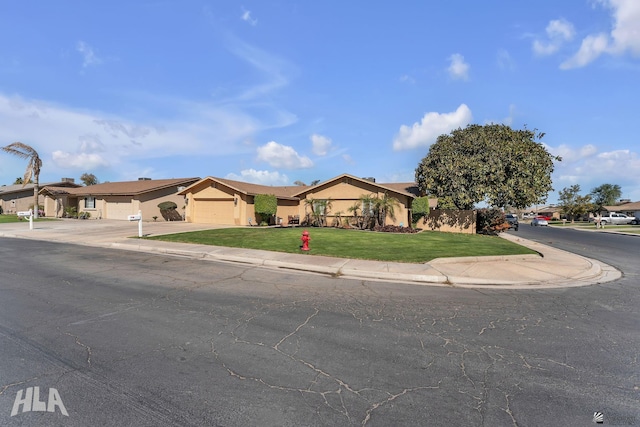 single story home featuring a garage, a residential view, concrete driveway, and stucco siding