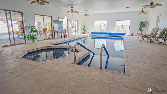 view of swimming pool featuring a covered pool and an indoor in ground hot tub