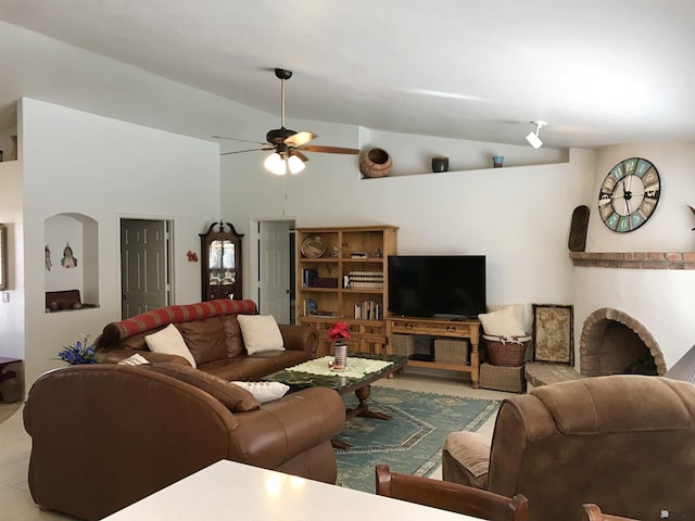 living room featuring ceiling fan and vaulted ceiling