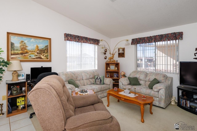 living room with lofted ceiling and light tile patterned flooring