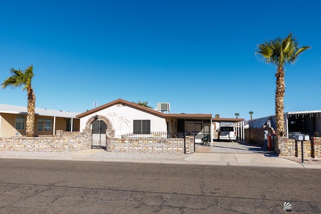 view of front of house featuring a carport and cooling unit