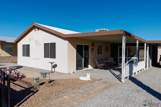 rear view of house with a patio