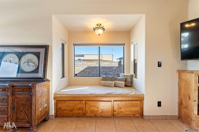 unfurnished room featuring light tile patterned floors