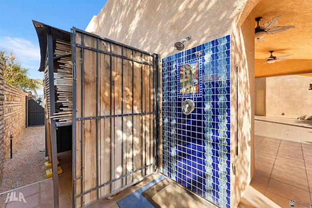 bathroom featuring tile patterned floors and ceiling fan