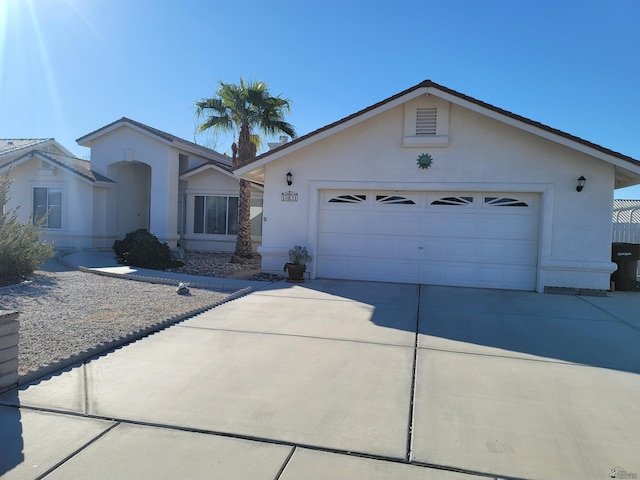 ranch-style house featuring a garage