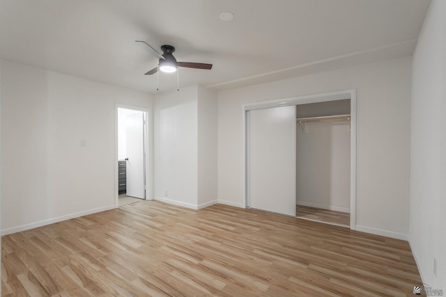 unfurnished bedroom with a closet, light hardwood / wood-style flooring, and ceiling fan