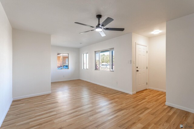 unfurnished room with light hardwood / wood-style floors and ceiling fan