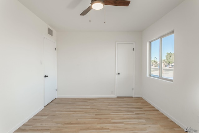 unfurnished room with ceiling fan and light hardwood / wood-style floors