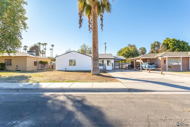 single story home with a carport