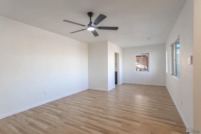 empty room featuring light hardwood / wood-style floors and ceiling fan