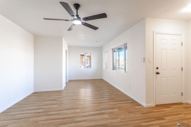 empty room featuring ceiling fan and light wood-type flooring