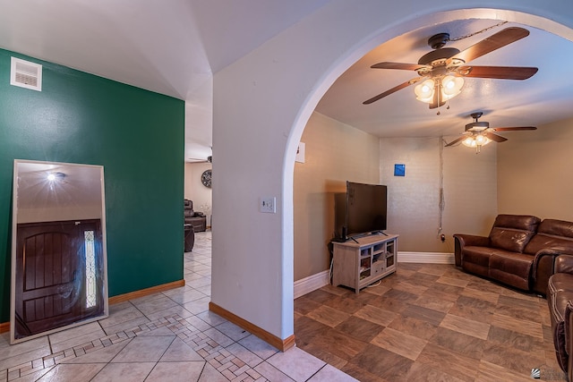 living room featuring ceiling fan