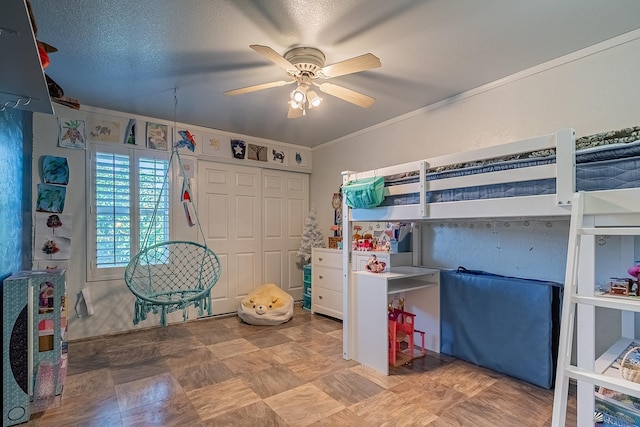 bedroom with a closet, ceiling fan, and ornamental molding